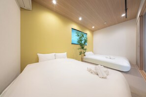 Suíte, 2 camas Queen | Wi-Fi de cortesia, roupa de cama
