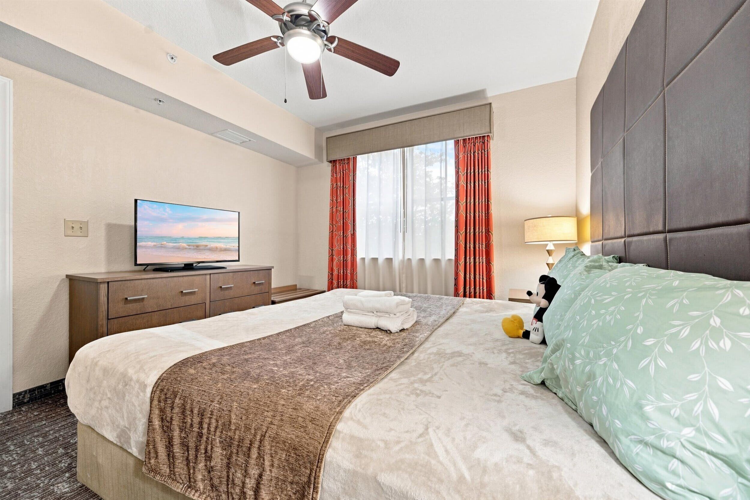 Sink into your plush bed after a day of adventure, cooled by the ceiling fan and soothed by soft lighting and thoughtful touches.
