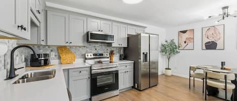 Coffee/tea maker, fridge, microwave, oven
