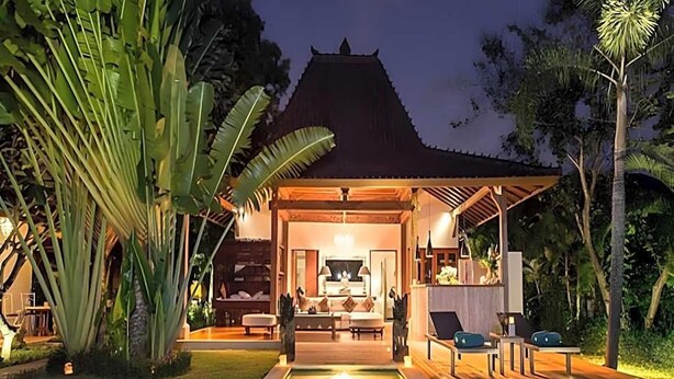 A modern villa with a pool, a covered outdoor area, and lush tropical vegetation. - The Radian Villa (Canggu)