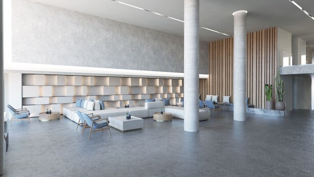 A spacious lobby with a modern design, featuring a seating area with sofas and chairs, a patterned wall, and a column structure. - Unique Blue Resort (Hersonissos)