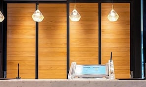 A reception desk with a computer and a telephone. - Super Hotel Okayama Station Higashiguchi (Okayama)