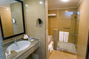 A bathroom with a sink, mirror, and a shower area. - Stella Gardens Resort Spa Makadi Bay (Makadi Bay)