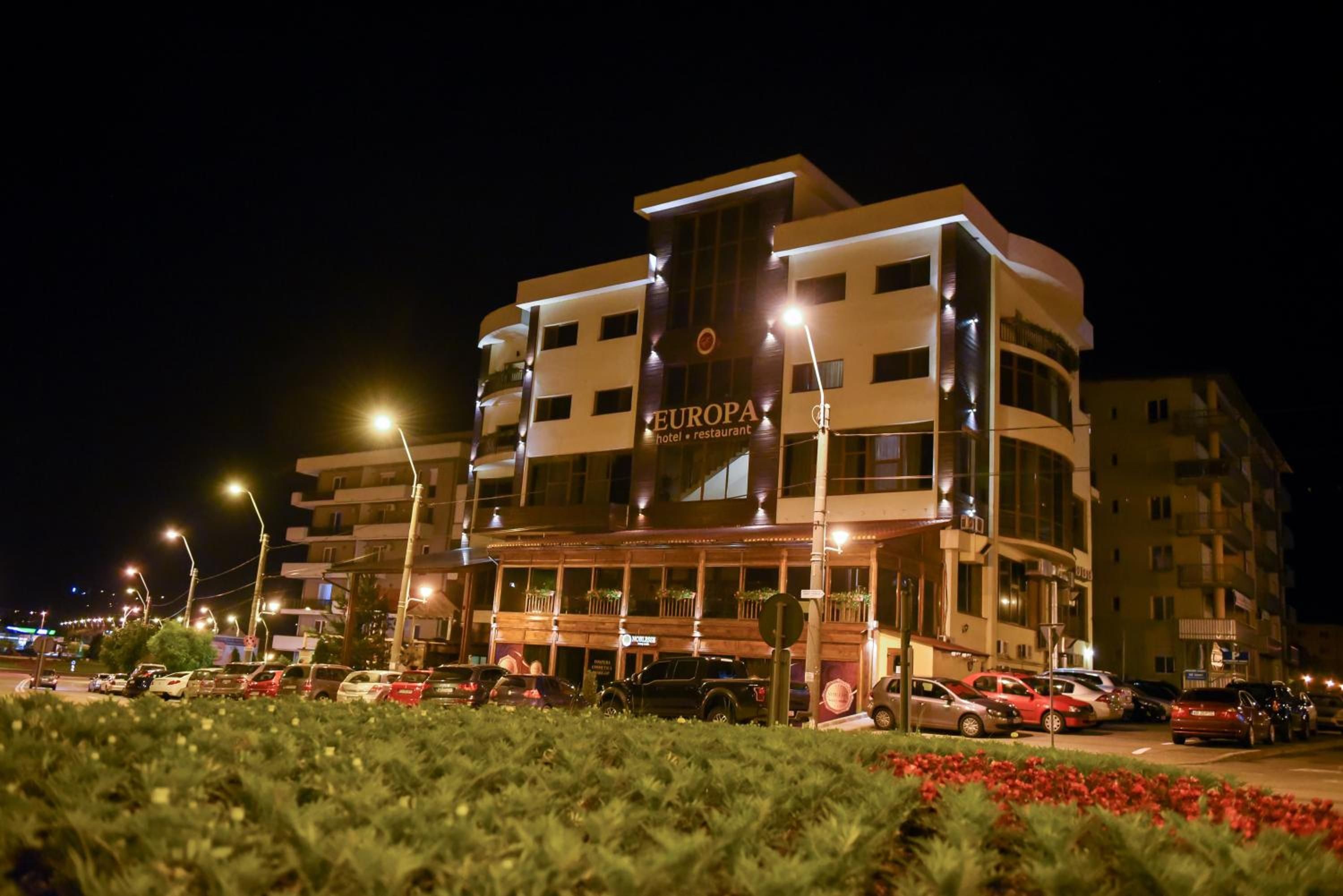 A multi-story hotel with a prominent sign reading 'EUROPA hotel restaurant'.