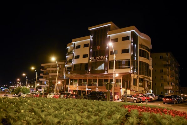 A multi-story hotel with a prominent sign reading 'EUROPA hotel restaurant'. - Hotel Europa (Baia Mare)
