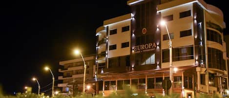 A multi-story hotel with a sign reading 'EUROPA hotel restaurant.'