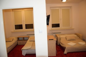 A bedroom with a bed, a desk, and a wardrobe. - Centrum Konferencyjne Ibib Pan (Warsaw)
