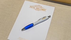 A pen on a white card with 'HOTEL HOLLOWAY' and a website address. - Hotel Holloway (Birmingham)