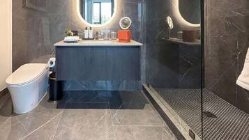 Superior Studio, 1 King Bed, City View | Bathroom | Shower, free toiletries, hair dryer, bathrobes