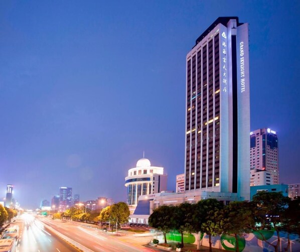 A high-rise hotel with a modern design, multiple floors, and a prominent entrance.