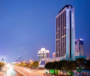 A high-rise hotel with a modern design, multiple floors, and a prominent entrance. - Grandskylight Shenzhen Dapeng (Shenzhen)