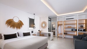 Un dormitorio moderno con una cama grande, mesitas de noche, un escritorio y un armario.