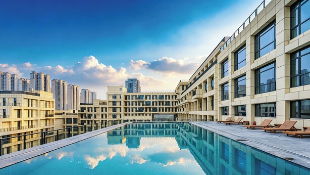 A modern hotel with a rooftop infinity pool, reflecting the surrounding buildings and sky. - Grand Skylight Hotel Wuhan Optics Valley (Wuhan)