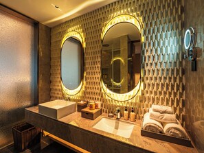 A modern bathroom with two sinks, a large mirror, and a towel rack. - Grand Skylight Hotel Wuhan Optics Valley (Wuhan)
