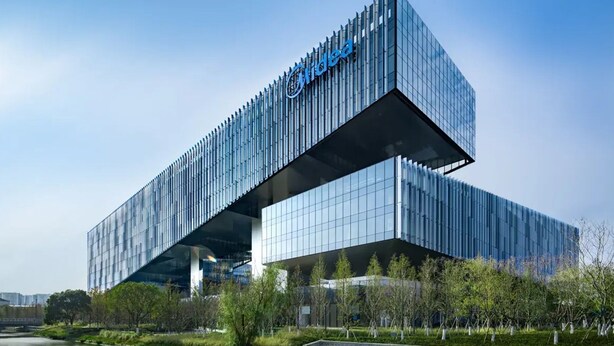 A modern building with a prominent logo, a flat roof, and a reflective glass facade. - Shanghai Also Hotel (Shanghai)