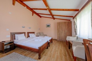 A bedroom with two beds, a wooden wardrobe, a desk, and a chair. - Hotel Zlatni Bor (Kovačka Dolina)