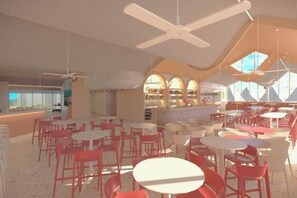 A spacious indoor area with multiple tables and chairs, a bar area, and a view through large windows. - Bounce Surfers Paradise (Gold Coast)