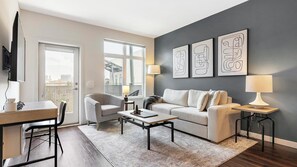 Apartment (1 Bedroom) | Living area | 50-inch TV with digital channels - Landing Furnished Apartments - Ranchstone (Houston)