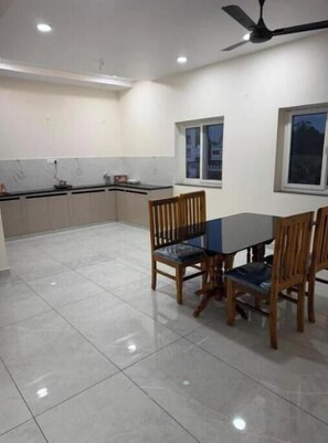 Dining - Elegant 2BHK Holiday Home with Terrace, Wi-Fi & Easy Airport Access (Godāvari)
