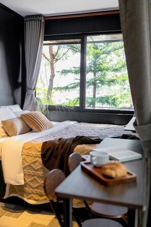 Deluxe Double Room, Patio, City View | Hypo-allergenic bedding, individually decorated, individually furnished