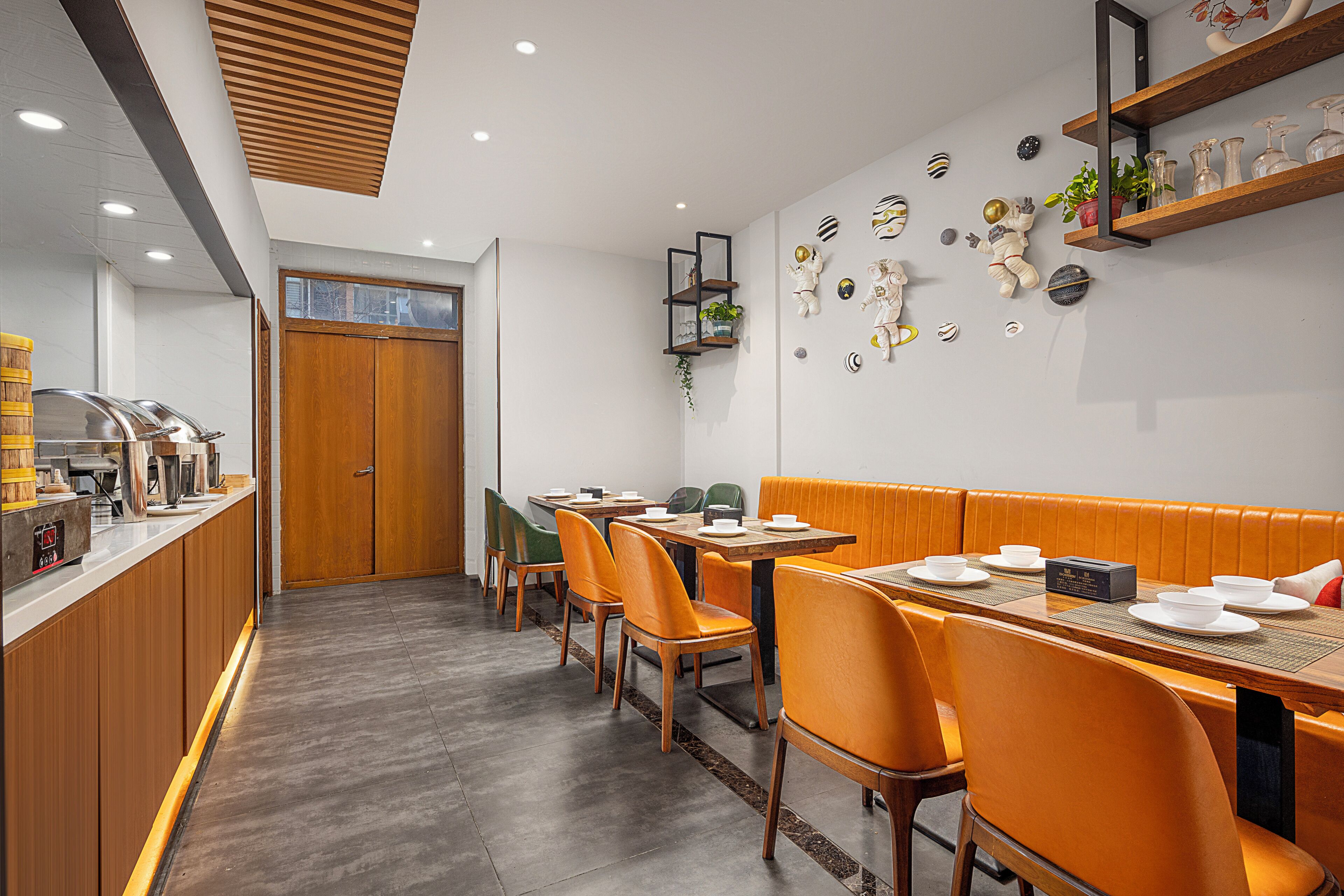A restaurant with wooden furniture, a buffet area, and wall decorations.