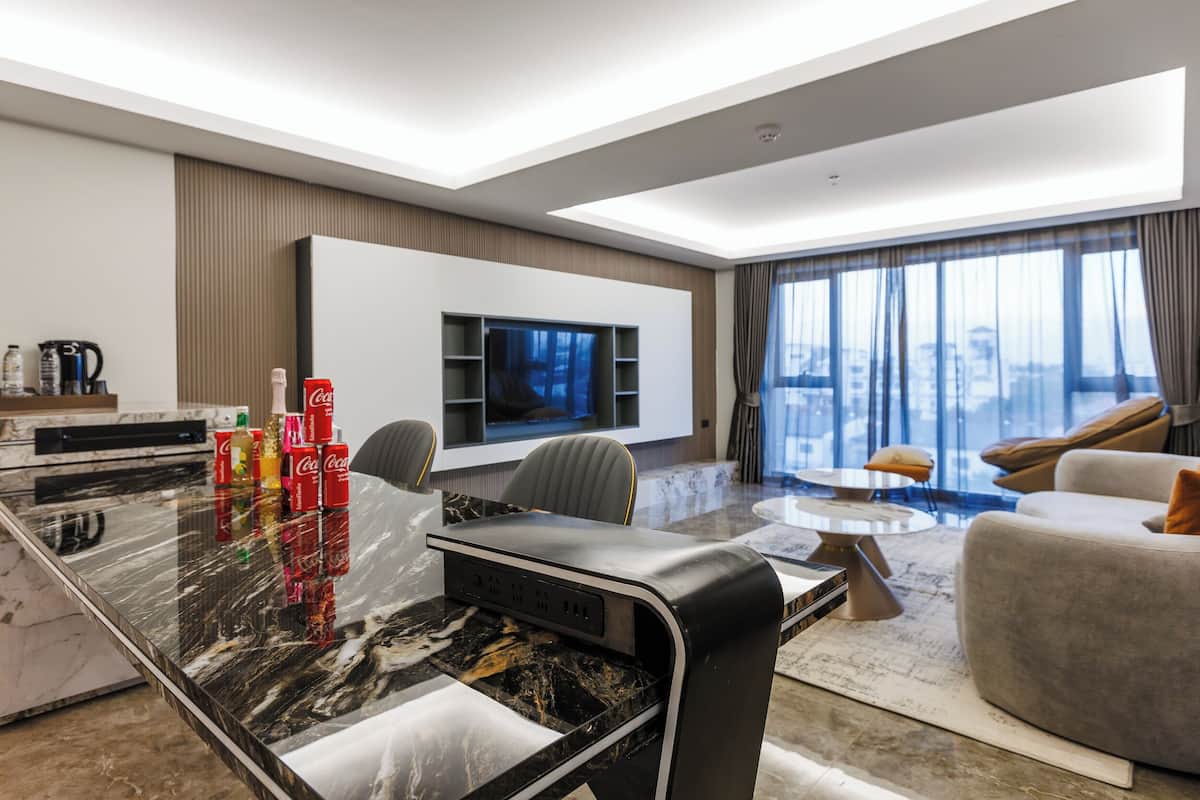 Luxury Suite | Premium bedding, desk, laptop workspace, blackout drapes