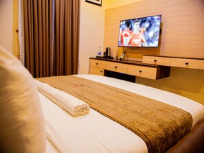Deluxe Room, Balcony, City View | Desk, laptop workspace, blackout curtains, soundproofing