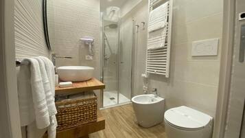 Deluxe Double or Twin Room, Balcony | Bathroom | Shower, hair dryer, slippers, towels