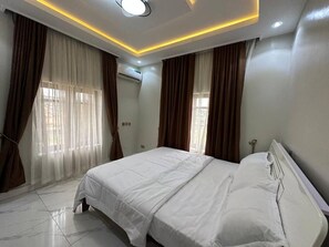 Family Room, Balcony, City View | Desk, laptop workspace, blackout curtains, soundproofing - Asabana Suites And Hotel (Enugu)