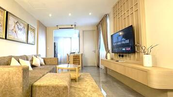 Luxury Suite, 1 Bedroom, Pool Access | Living area | 32-inch LCD TV with cable channels