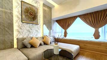 Apartment, 2 Bedrooms, City View | Living area | 32-inch LCD TV with cable channels