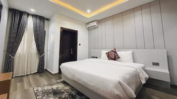 Economy Room, Balcony, City View | Desk, laptop workspace, blackout drapes, soundproofing