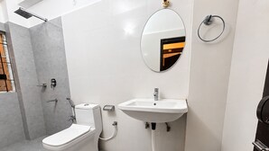 A bathroom with a toilet, sink, and shower. - The Happy Nest- A Boutique stay only 5 mins from Assam State Zoo (Guwahati)