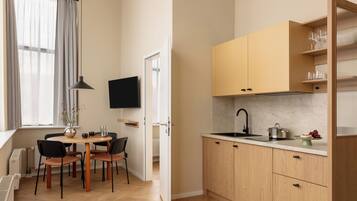 Desk, laptop workspace, iron/ironing board (on request), cribs (free)