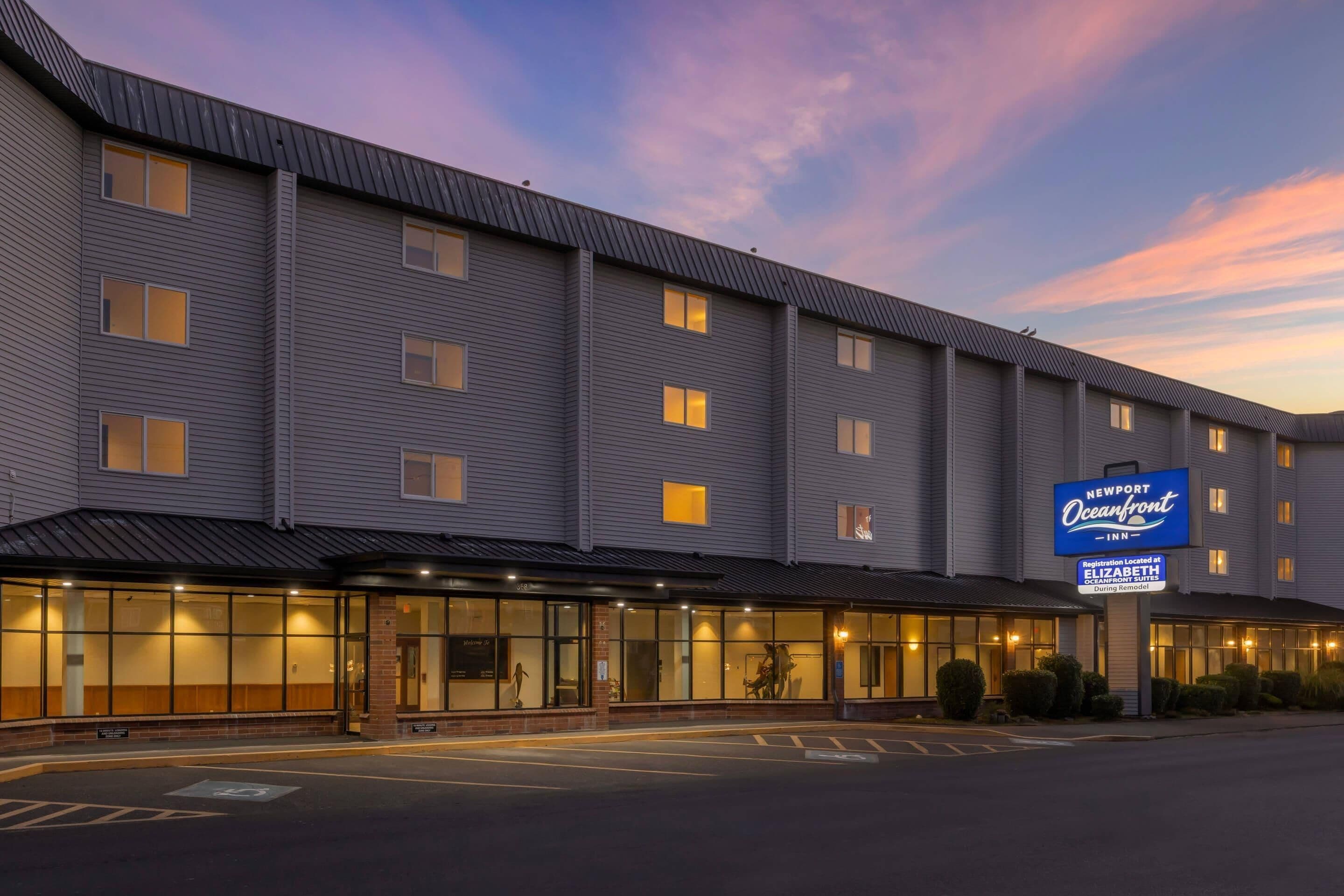 A multi-story hotel with a flat roof, large windows, and a sign indicating it is a New York Marriott.
