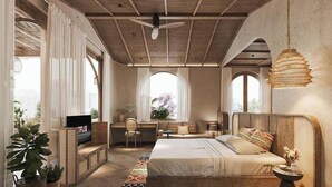 A bedroom with a bed, a desk, a chair, and a TV.