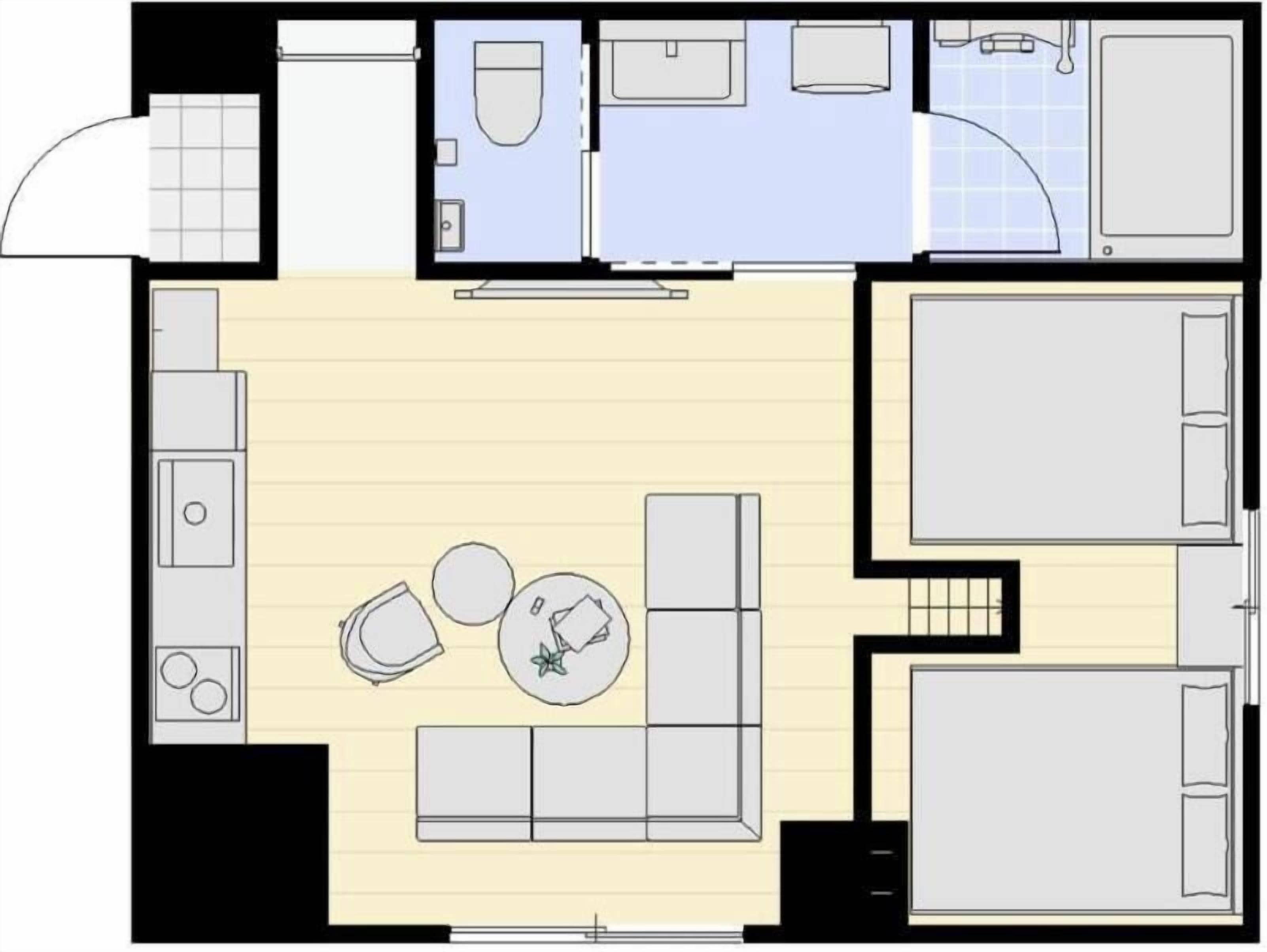 A floor plan of a hotel room with a living area, kitchenette, bathroom, and a separate bedroom.