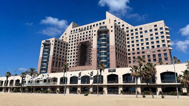 A large hotel with multiple floors, a central atrium, and a beachside location. - Azure Beach Apartments (Haifa)