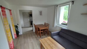 Apartamento família, vista para o vale | Área de estar