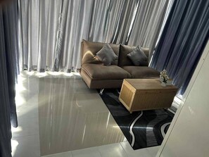 Villa Deluxe, balcón, vista al jardín | Área de sala de estar