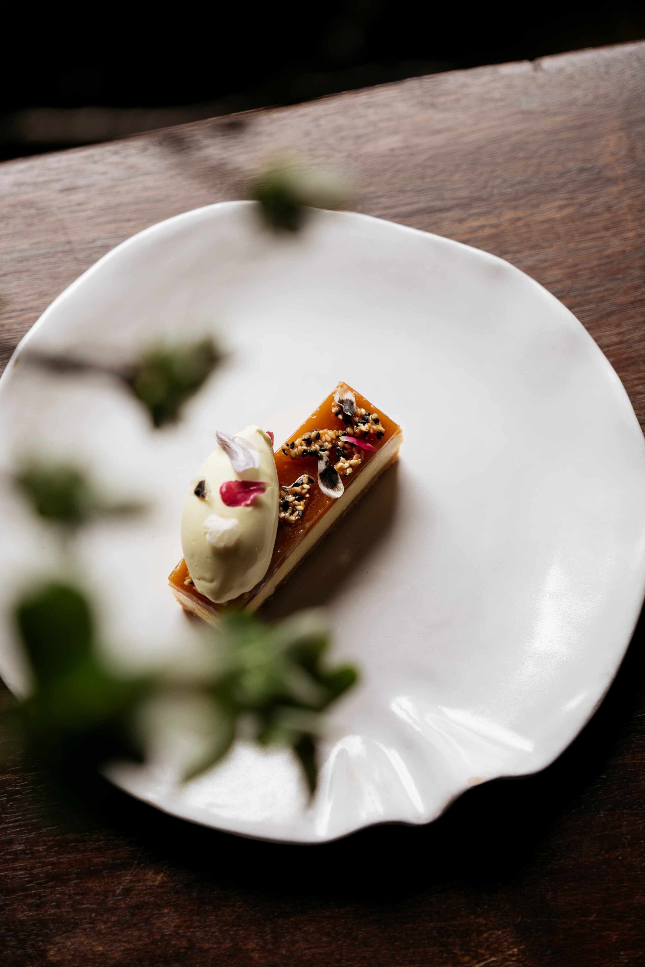 A dessert on a white plate with a wooden table background.