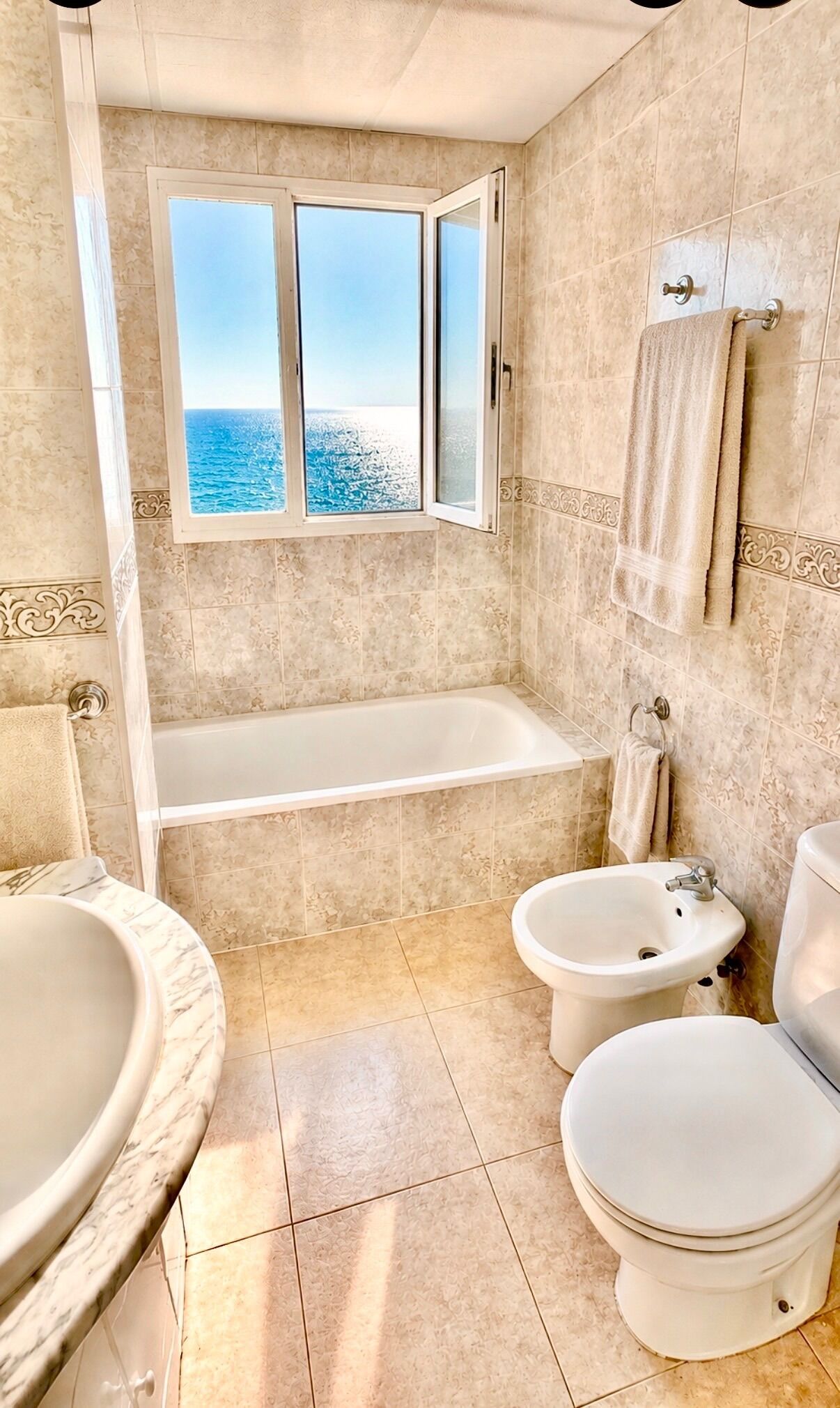 Combined shower/bathtub, deep-soaking bathtub, towels