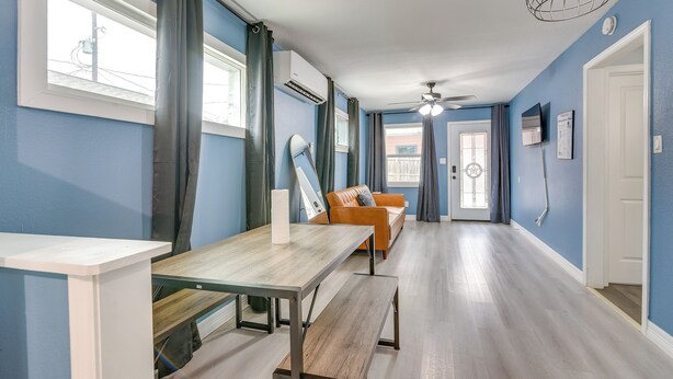 A room with a dining table, a sofa, a ceiling fan, and a window with curtains. - 6 Mi to TMC & Hermann Park! SE Houston Home (Houston)