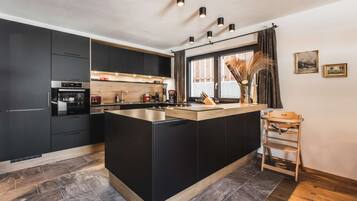Coffee/tea maker, fridge, microwave, oven