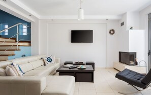 House | Living area | 55-inch Smart TV with satellite channels, fireplace - Anavil House Athenian Riviera (Vari)