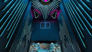 A modern interior with a central circular light fixture, linear neon lights, and a mirrored ceiling. - Haven Hotel (Ho Chi Minh City)