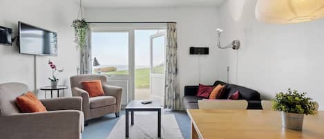 Elegant Apartment with Full Kitchen - 12D | Living area | 24-inch LED TV with digital channels