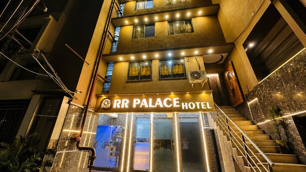 A multi-story hotel with a prominent sign reading 'RR PALACE HOTEL.' - Hotel Grand Riva (Rajkot)
