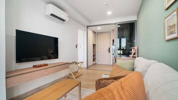 One Bedroom 1Cx Deluxe | Living area | 43-inch Smart TV with digital channels