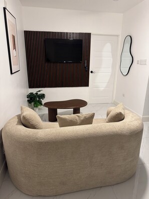 Living area - This is an elegantly retrofitted secured ground floor one bedroom apartment. (Kingston)